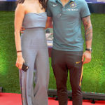Anushka Sharma is slayin' it in a jumpsuit as she poses with Virat Kohli at the premiere of Sachin: A Billion Dreams!