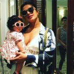 ADORABLE! Priyanka Chopra in a plunging neckline twinning in sunglasses with this little munchkin! See PICS!